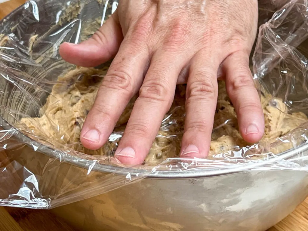 Putting plastic wrap over cookie dough before refrigerating it