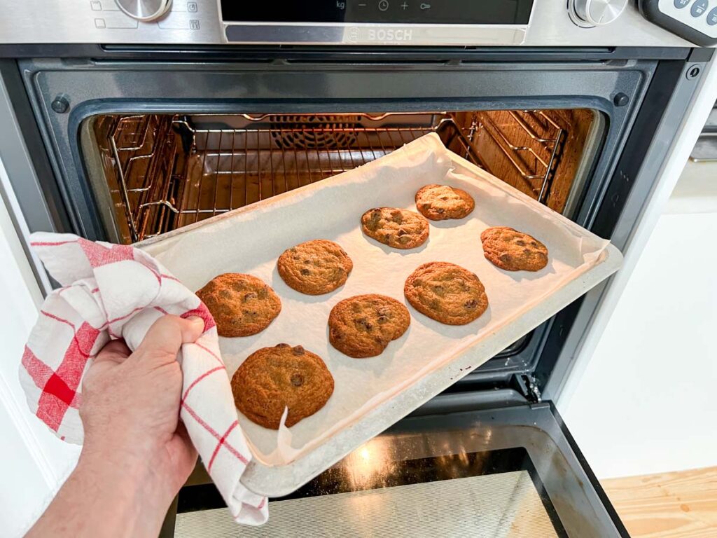 Taking cookies out of the oven