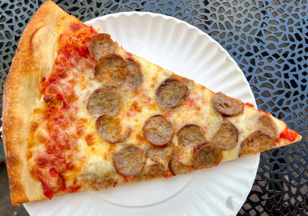 Pizza Slice with Sausage at Rosas in NYC