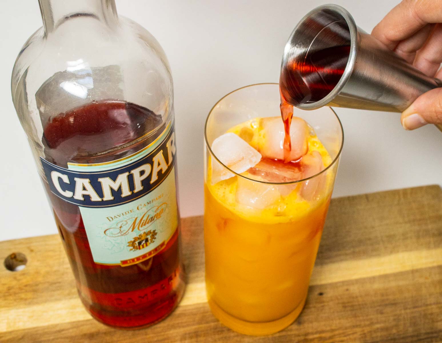 Pouring Campari into a Garibaldi Cocktail(1)