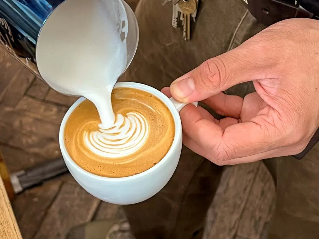 Crafting a Flat White at Cafe Comet Furth Coffee in Vienna
