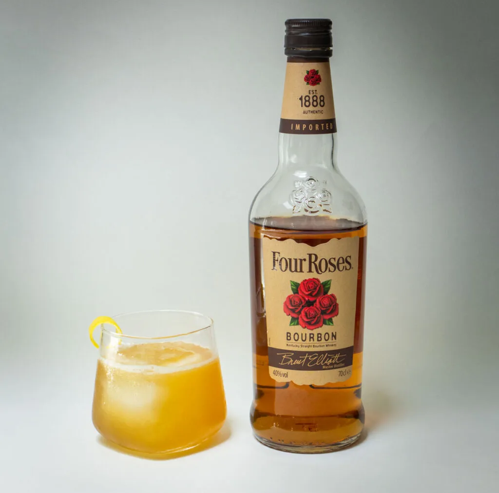 Gold Rush Cocktail with Bourbon Bottle