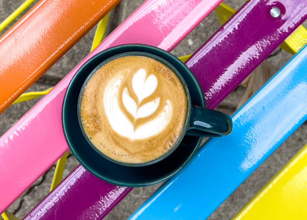 Cappuccino with on Colorful Chair at Vibrant Coffee Roasters and Bakery in Philadelphia