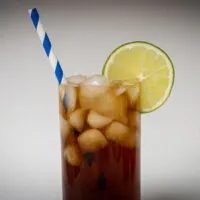 Cuba Libre Cocktail with Straw and White Background