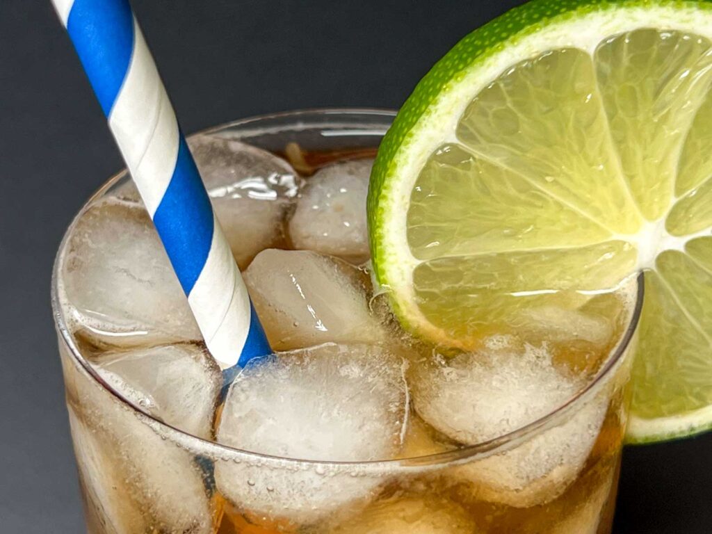 Cuba Libre Cocktail with Striped Straw