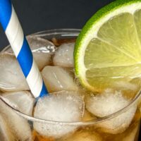 Cuba Libre Cocktail with Striped Straw