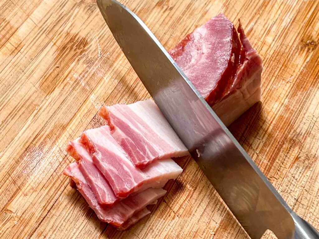 Cutting Bacon to Make Bacon Bits