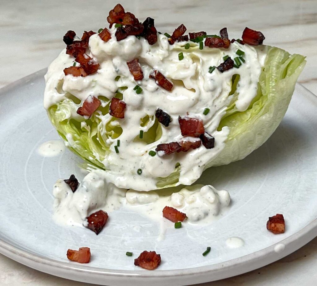 Wedge Salad on a rustic white plate