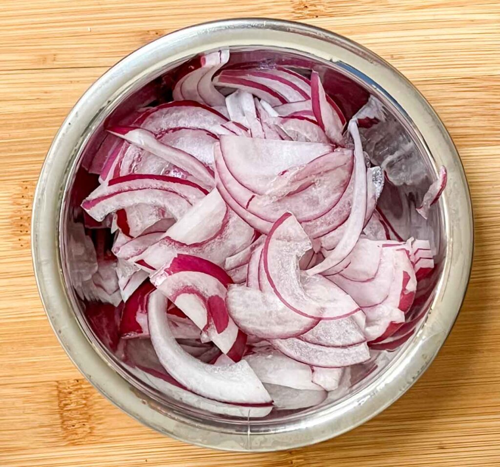 Sliced Red Onions in a Silver Prep Bowl