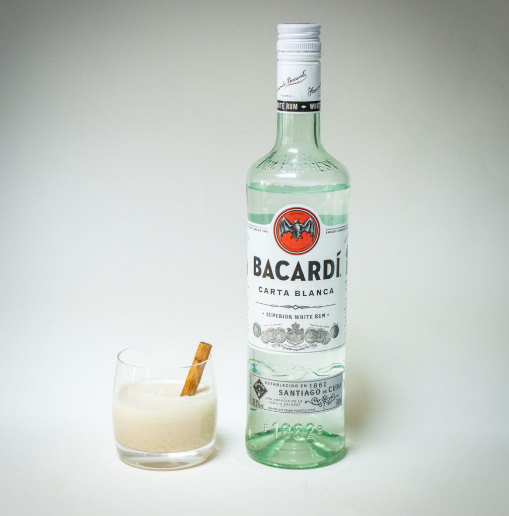 Coquito Glass and Rum Bottle