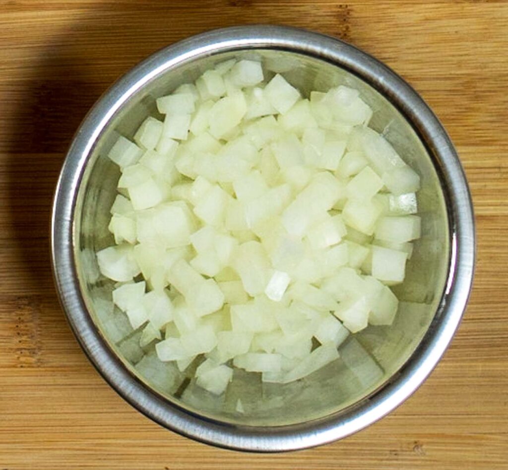 Onions in a silver steel bowl