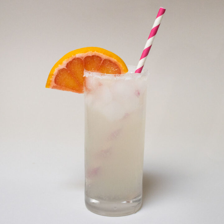 Paloma Cocktail with Pink Striped Straw