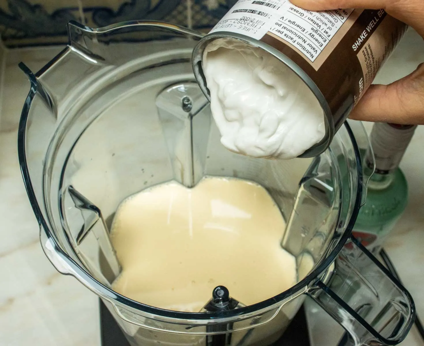 Pouring Coconut Cream into Blender