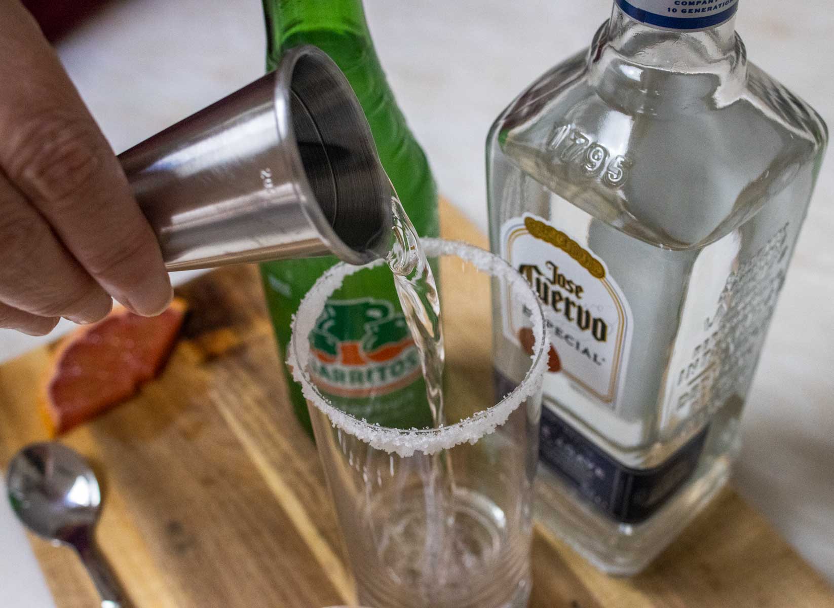 Pouring Tequila for a Paloma Cocktail