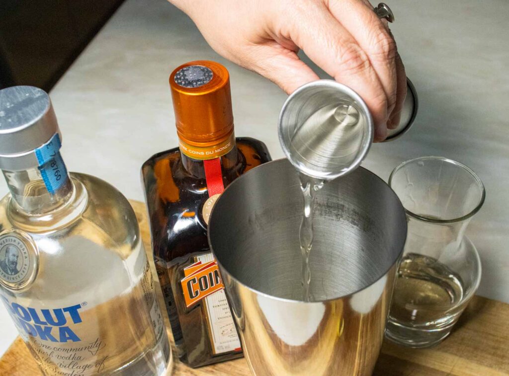 Pouring Vodka into a Lemon Drop Martini