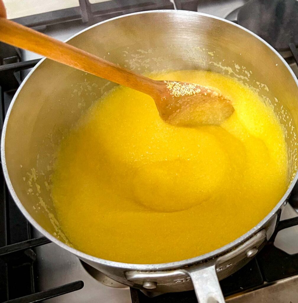 Stirring polenta in a sauce pan