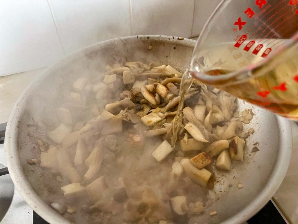 White wine added to a mushroom saute