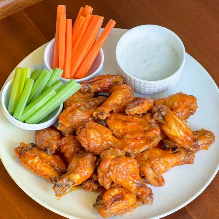Buffalo wings with celery carrots and blue cheese dressing