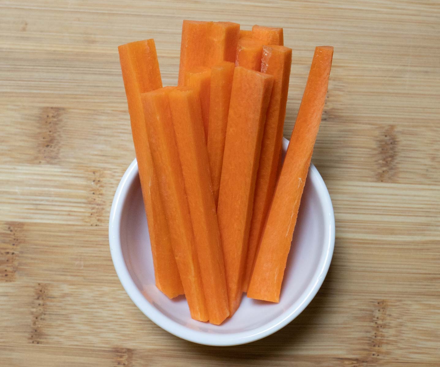 Carrot Sticks in small white bowl