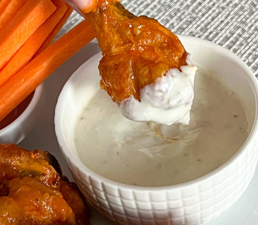 Dipped Buffalo wing with Blue Cheese dressing