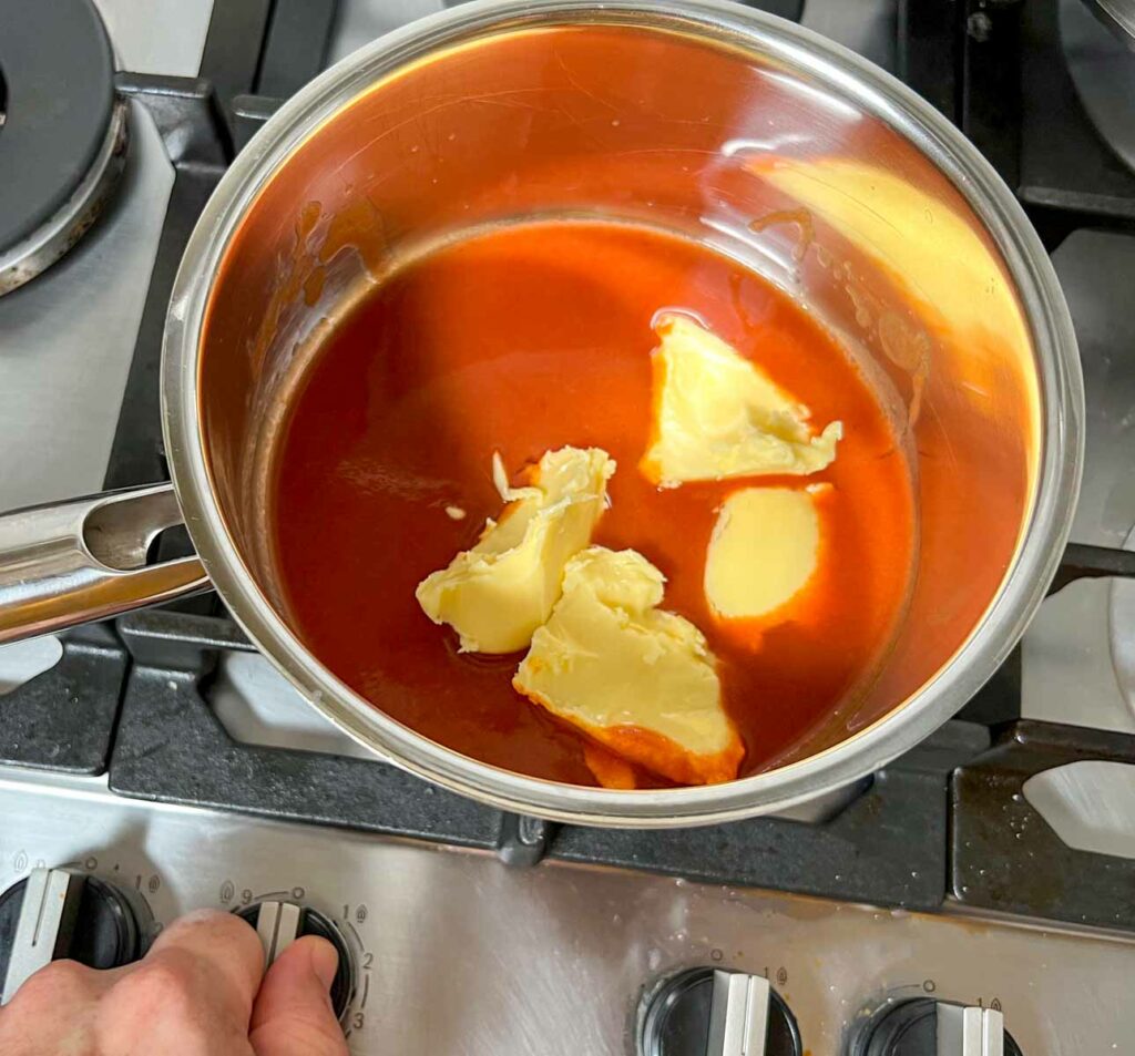 Hot sauce and butter on the stove