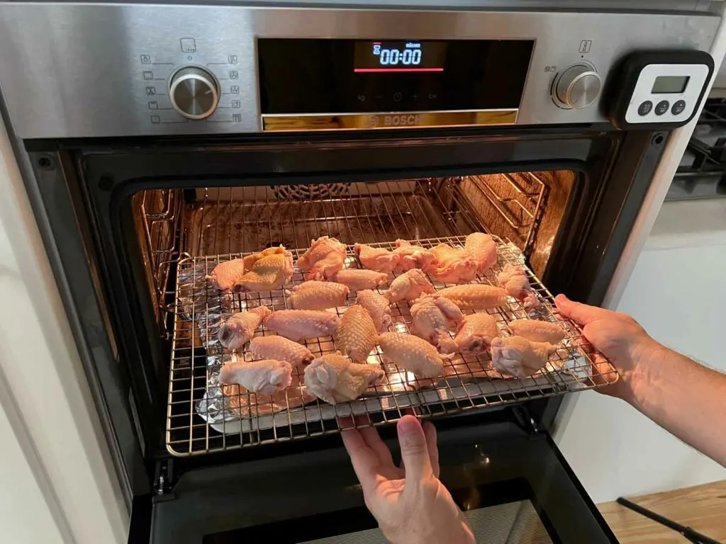 Placing wings in the oven