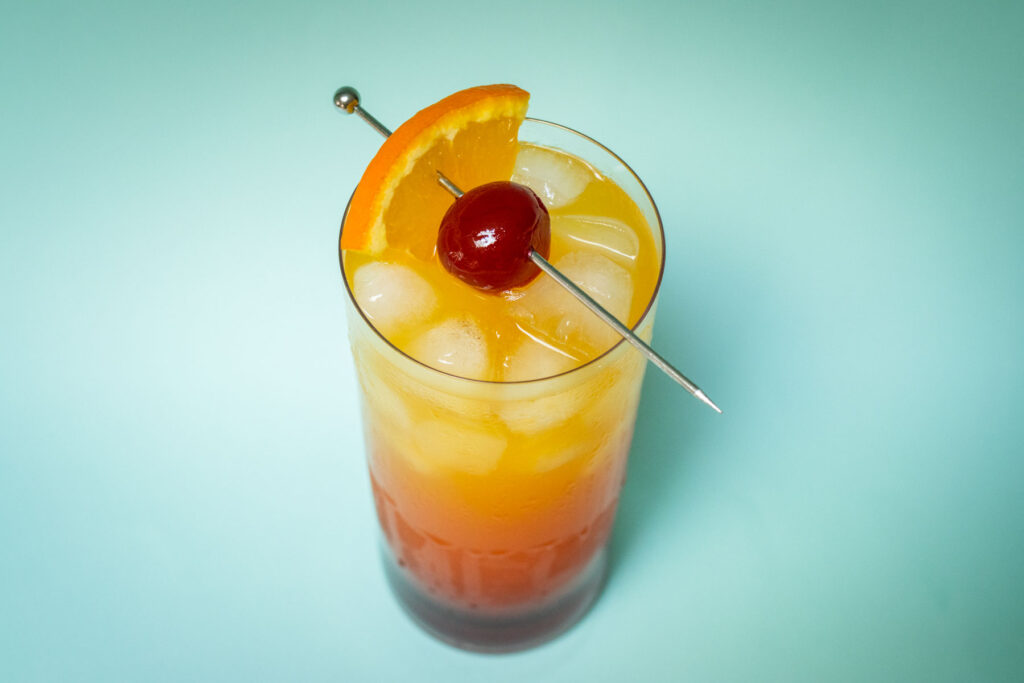 Tequila Sunrise with Blue Background from Above