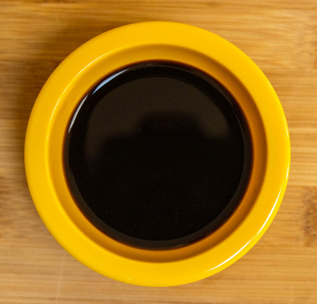 Chinkiang Vinegar in a Small Yellow Prep Bowl