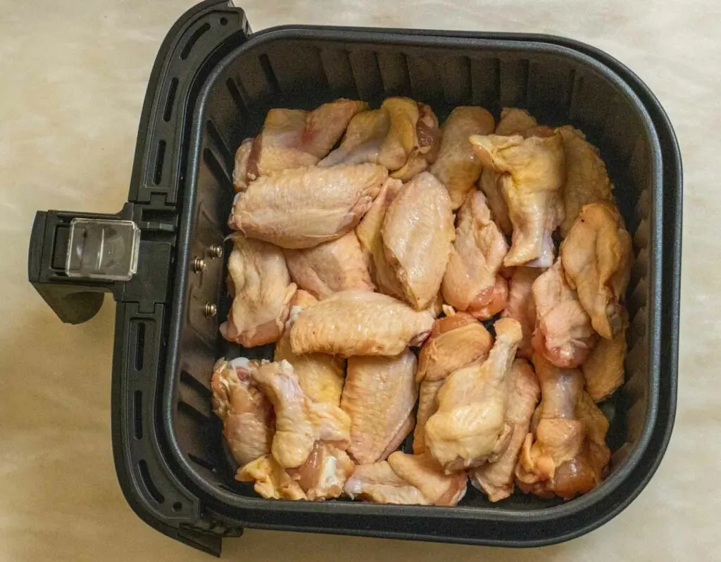 Raw Chicken Wings in an Air Fryer Tray