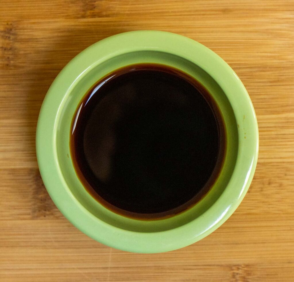 Soy Sauce in a Small Light Green Bowl