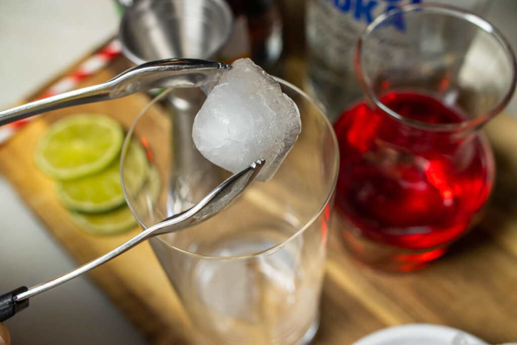 Adding Ice to a Woo Woo Cocktail