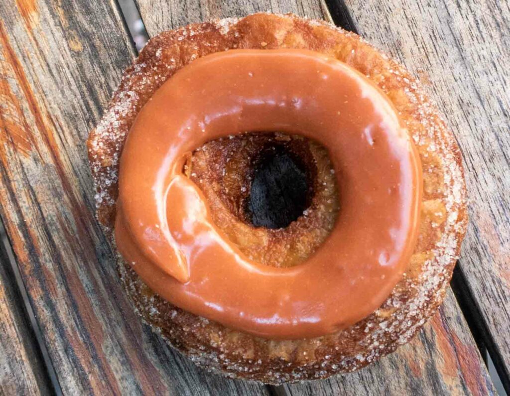 Cronut on Wood Table at Dominique Ansel Bakery in New York City