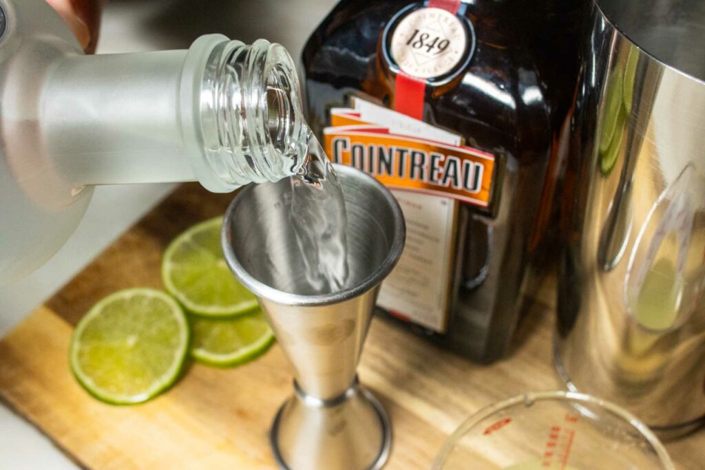 Measuring Vodka for Cosmopolitan Cocktail