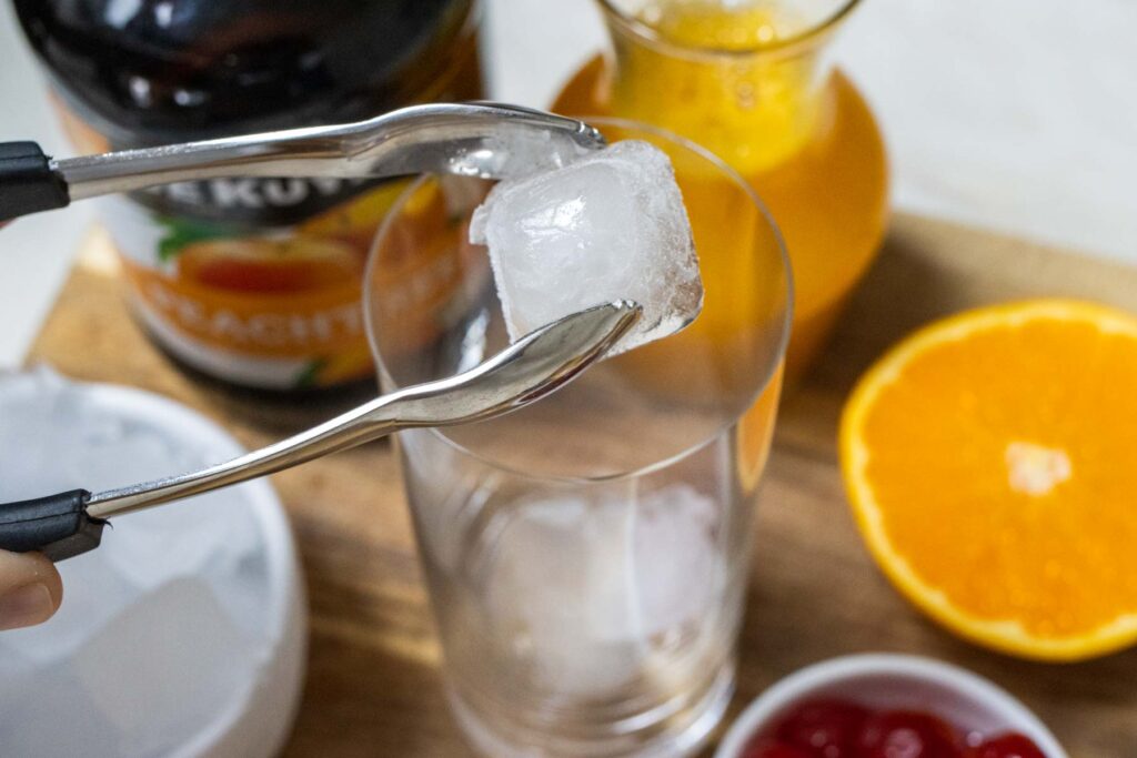 Placing Ice in Glass for Fuzzy Navel