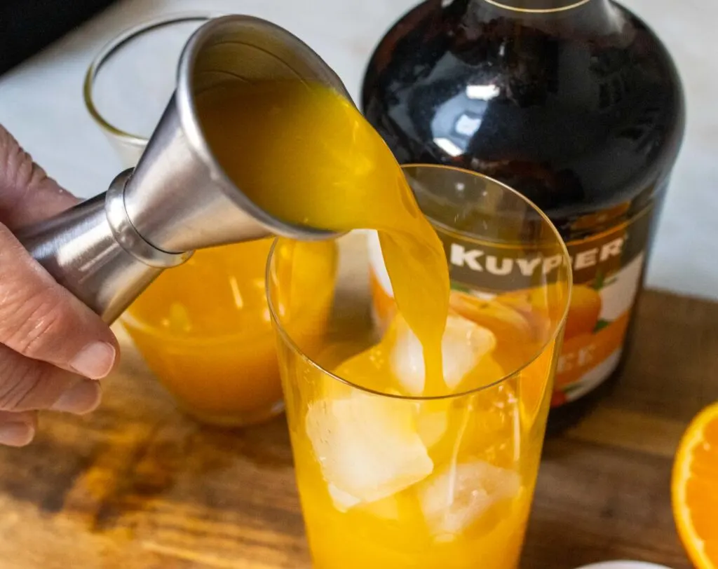 Pouring Orange Juice into Fuzzy Navel