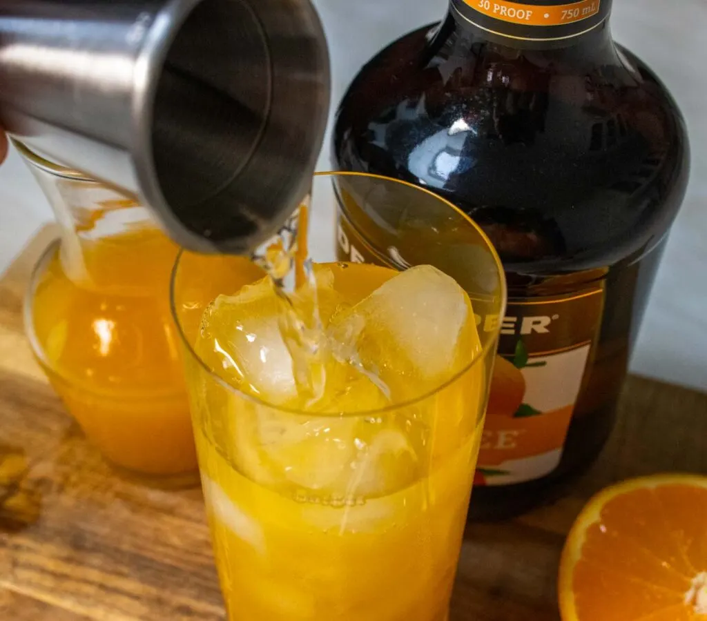 Pouring Peach Schnapps into Fuzzy Navel
