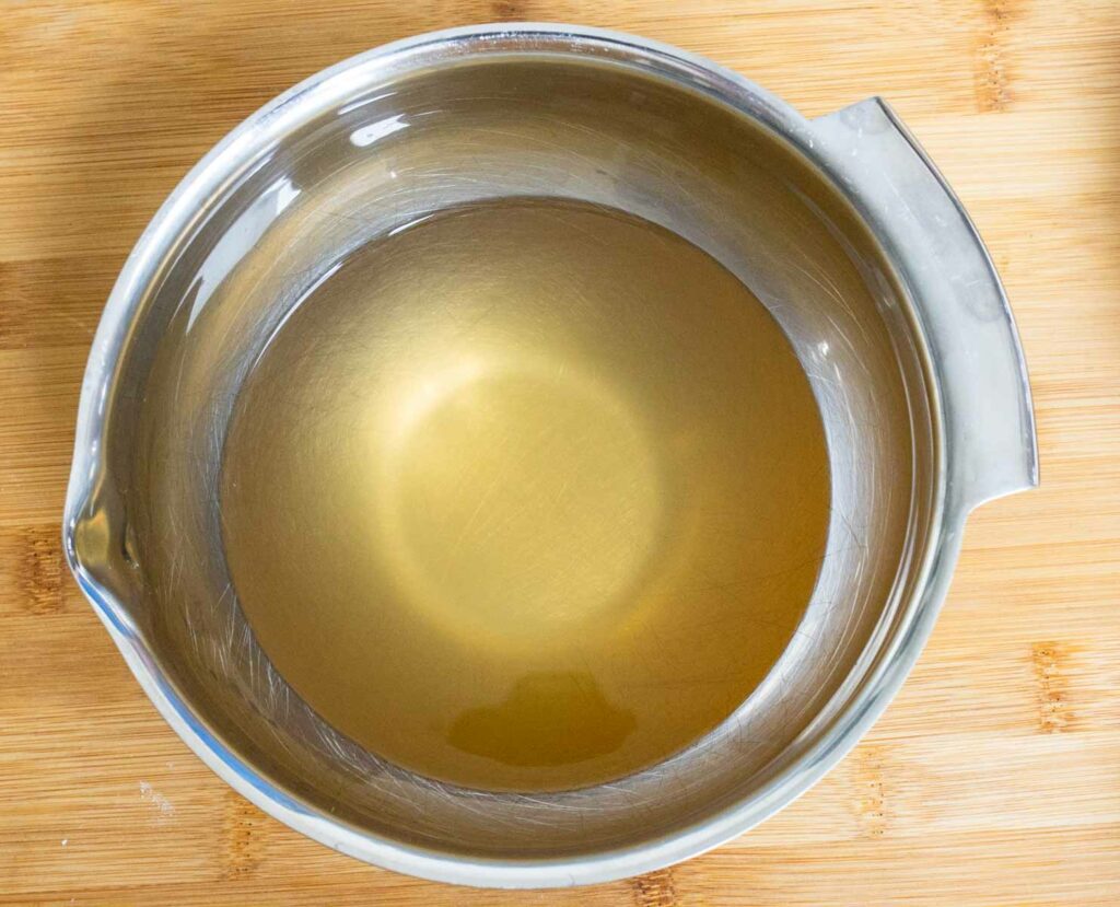 Beef broth in a silver bowl