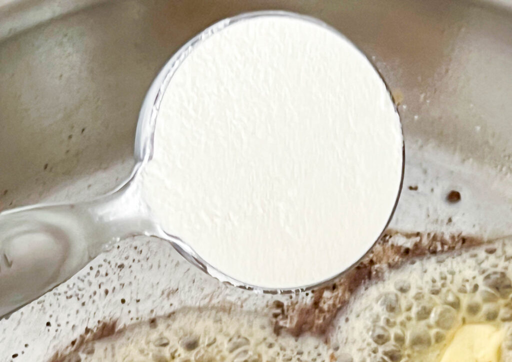 Flour in a quarter cup measure
