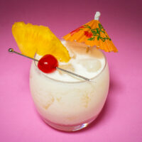 Pina Colada with Pink Background from Above