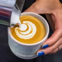 Crafting a Flat White at Onesip coffee in Prague