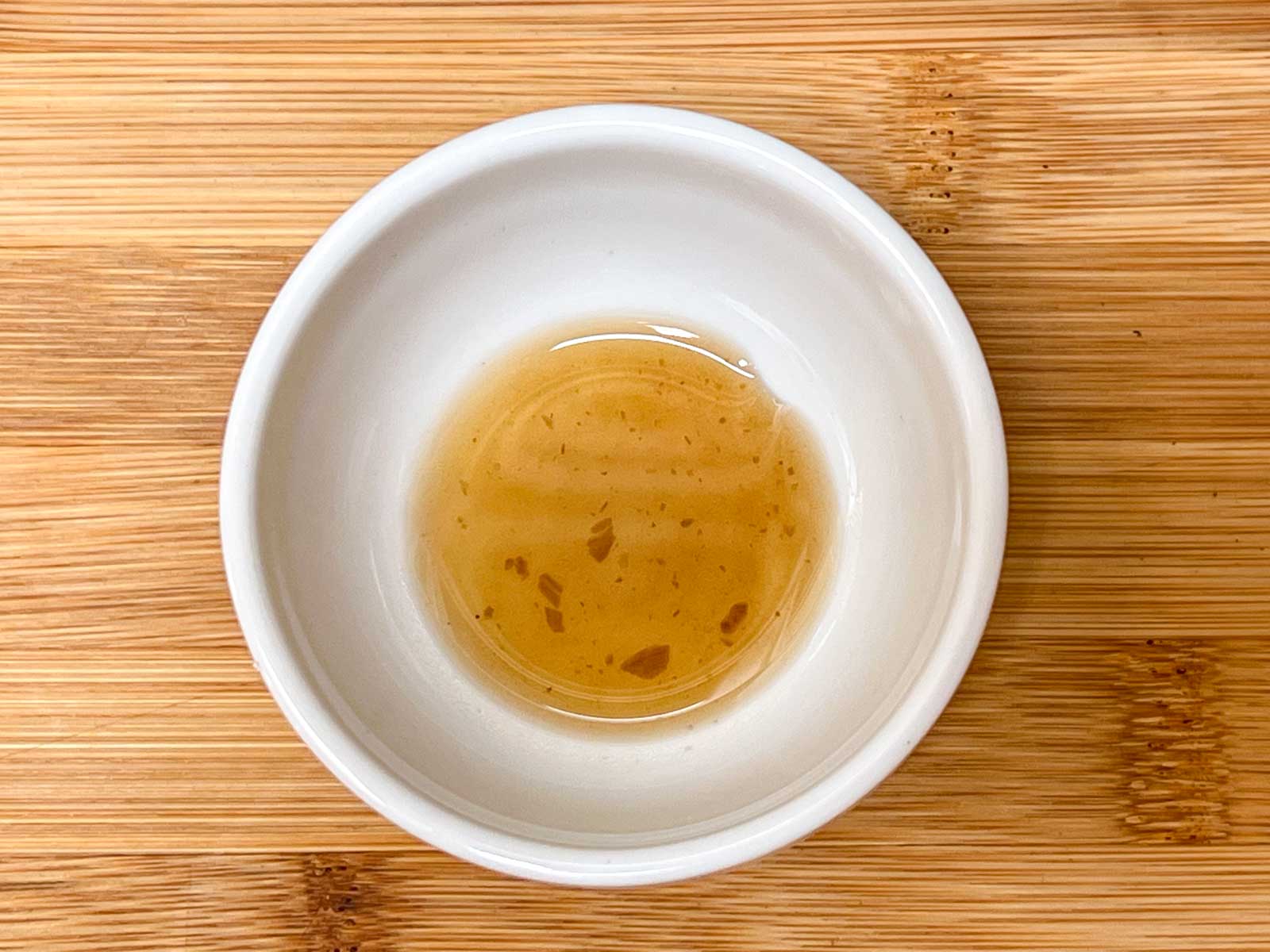 Sesame oil in a white bowl