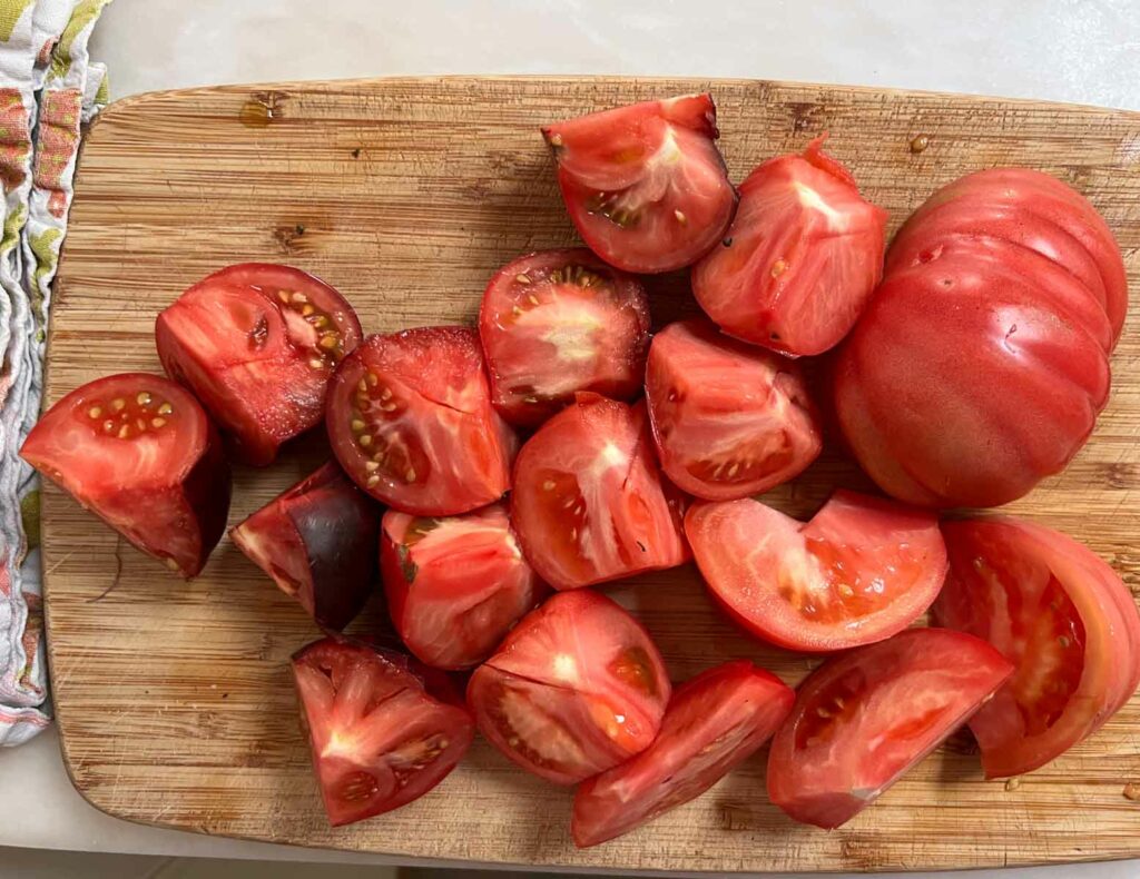 Chopped tomatoes on a wooden cutting board