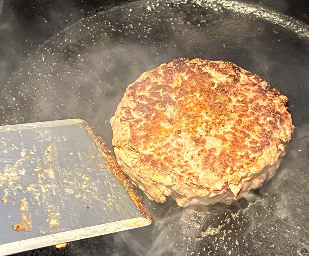 Cooking a burger in a cast iron skillet