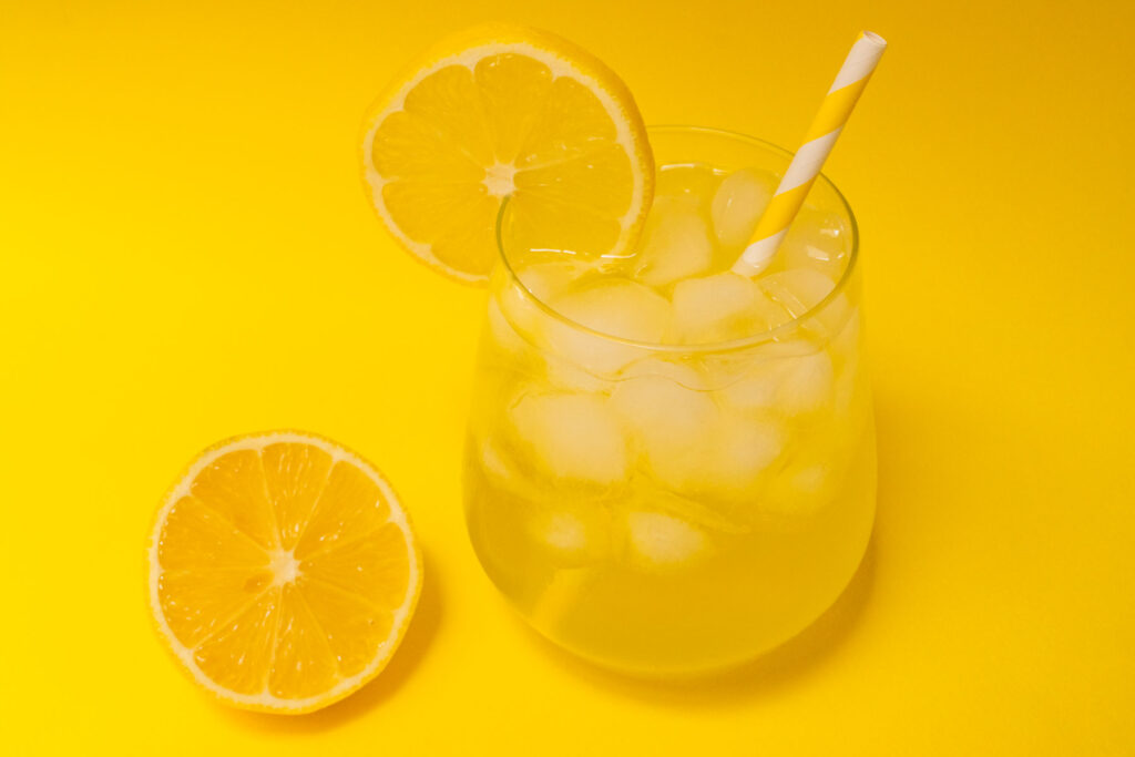 Limoncello Spritz and Lemon with Yellow Background