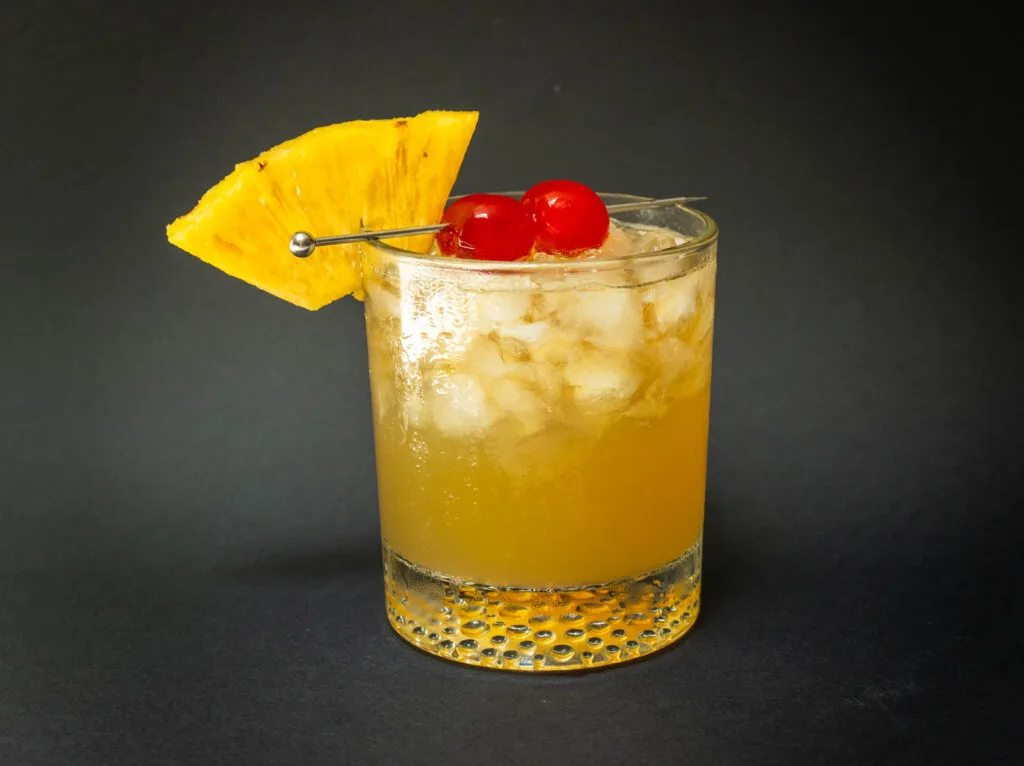 Mai Tai cocktail with a black background in the middle