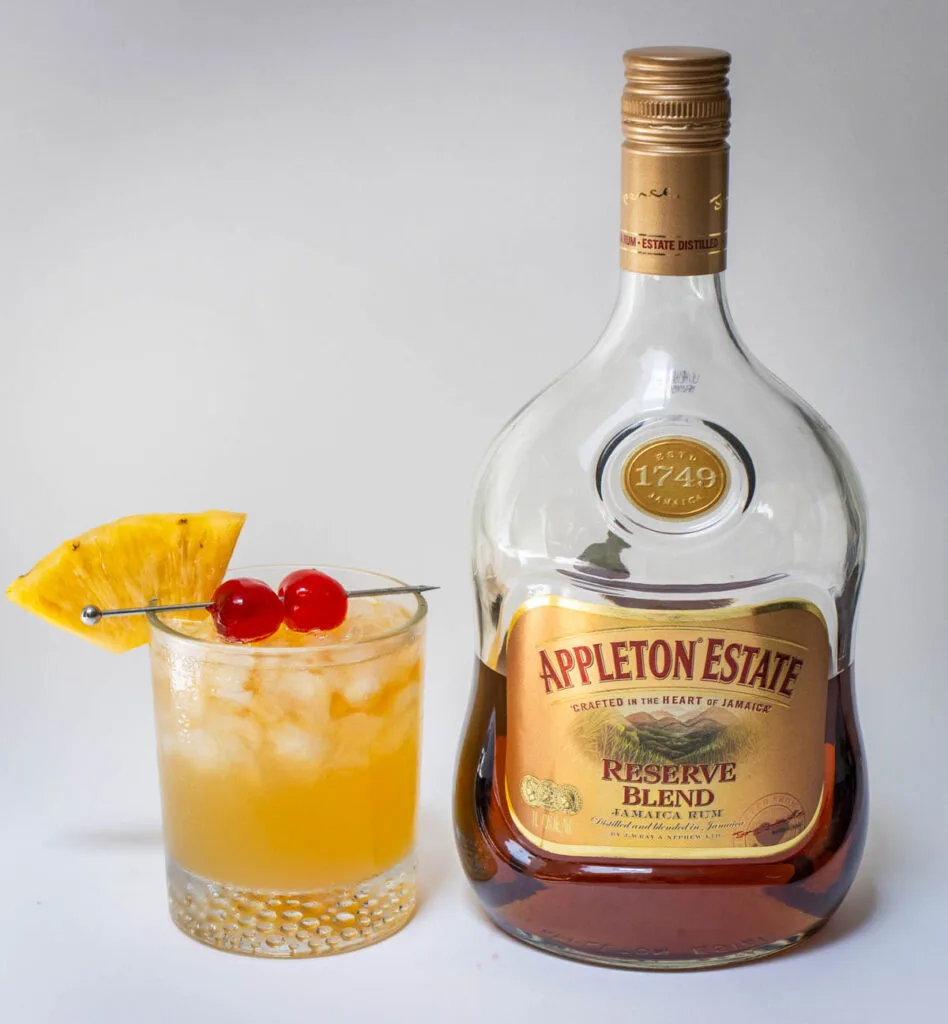 Mai Tai cocktail with a bottle of rum