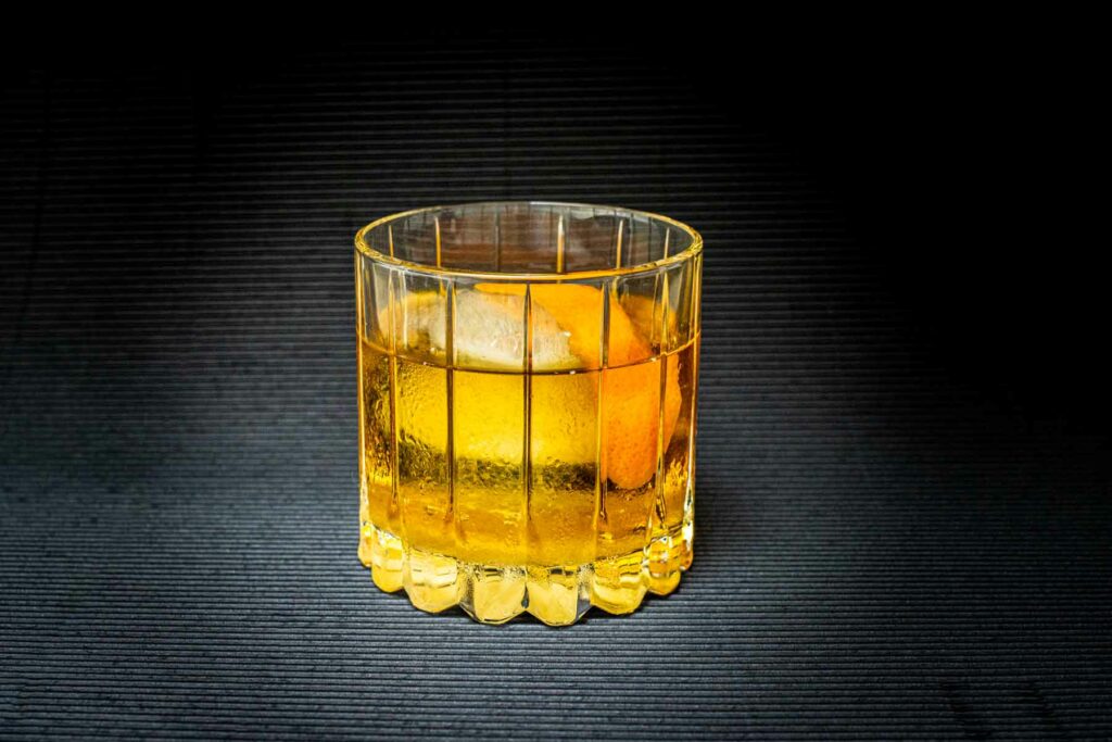 Old Fashioned Cocktail with Black Background Centered