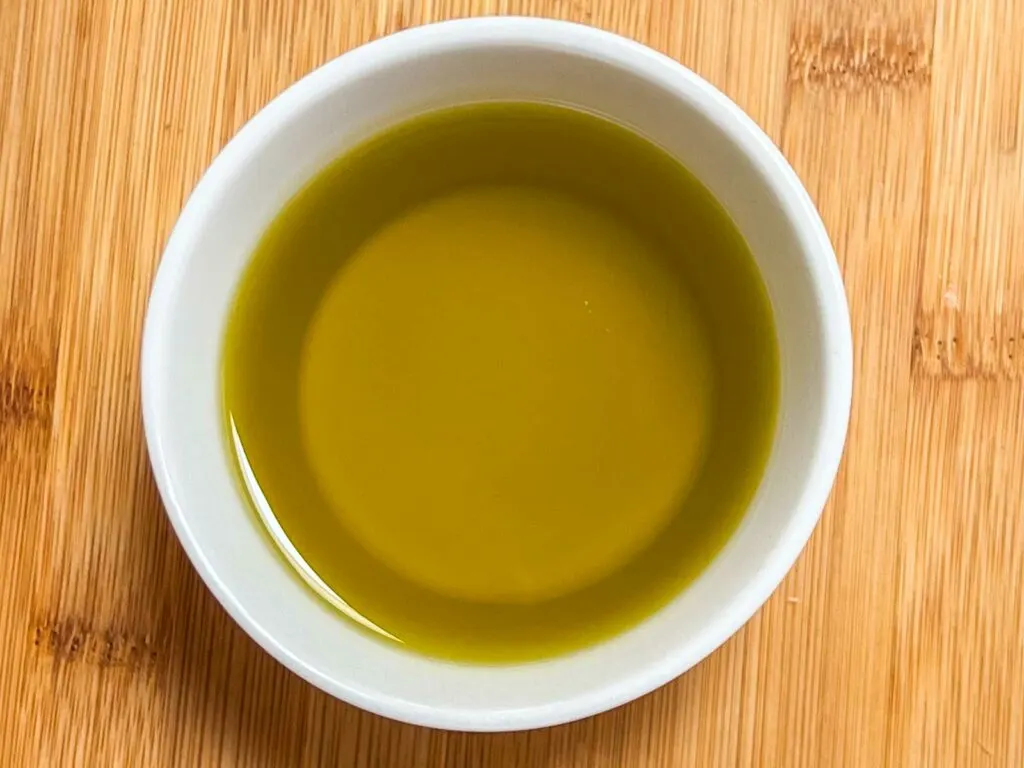 Olive oil in a white ramekin