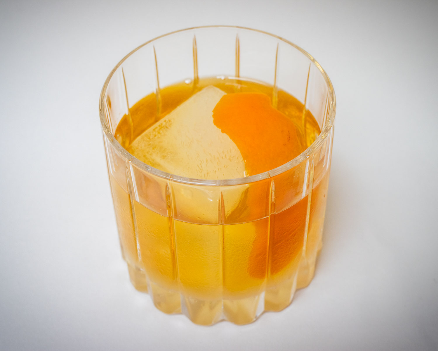 Rum Old Fashioned Cocktail with White Background Centered
