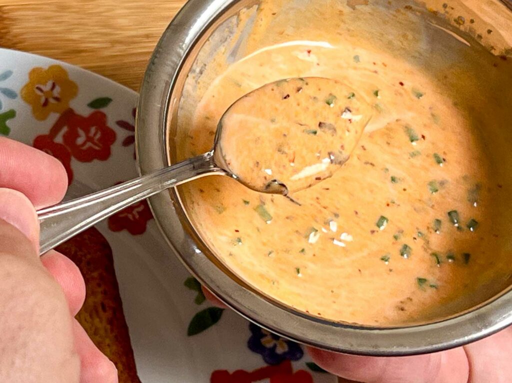 Spoon with completed Chili Crisp Lime Mayo